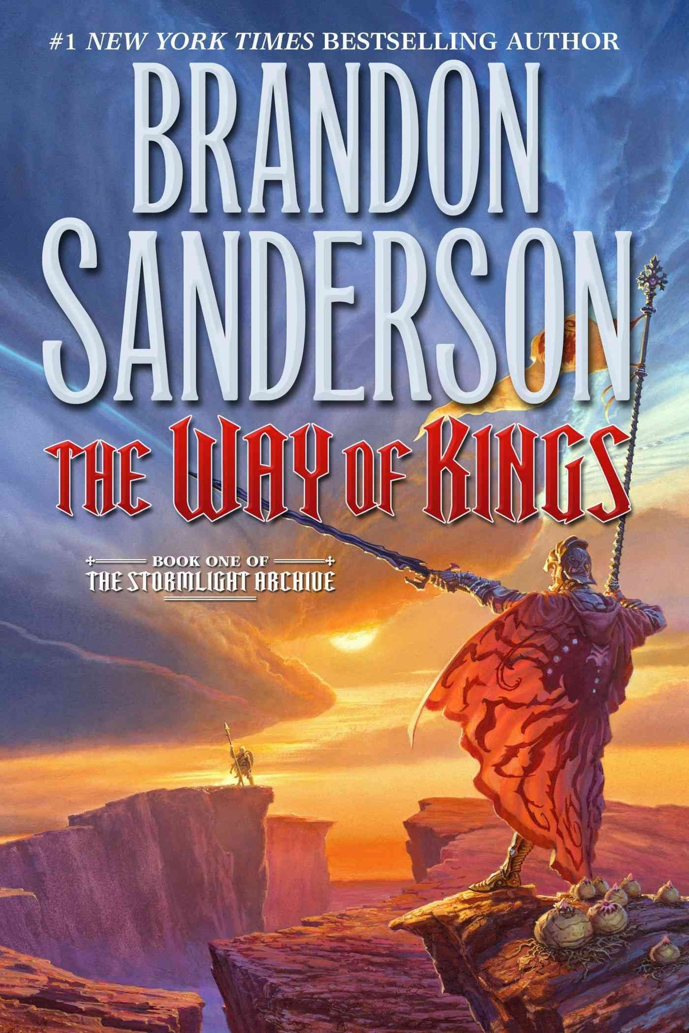 Book cover of 'The Way of Kings' by Brandon Sanderson, featuring a fantasy landscape with a dramatic sky and a figure in a red cloak holding a spear on a rock ledge.