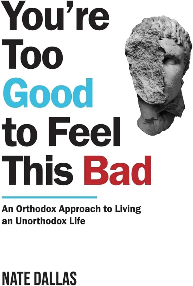 "Book cover of 'You're Too Good to Feel This Bad' by Nate Dallas, featuring a fragmented classical statue head."